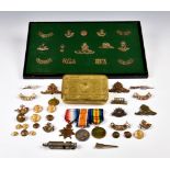 A Guernsey mans World War One (WWI) military medal and badge collection