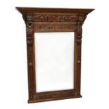 A late 19th century carved oak console mirror