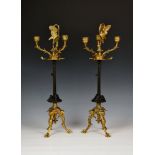 A pair of ormolu and patinated three branch candelabra by Auguste Maximilien Delafontain
