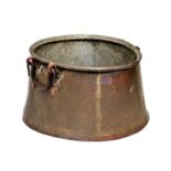 A large 19th century copper cauldron with twin wrought iron handles