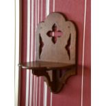 A Victorian Gothic Revival oak clock bracket