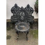 A set of three Victorian cast iron garden chairs in the style of Coalbrookdale