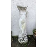 A large painted composite stone garden statue of a classical maiden, draped in diaphanous robes