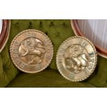A pair of cast bronze circular heraldic plaques or tampions