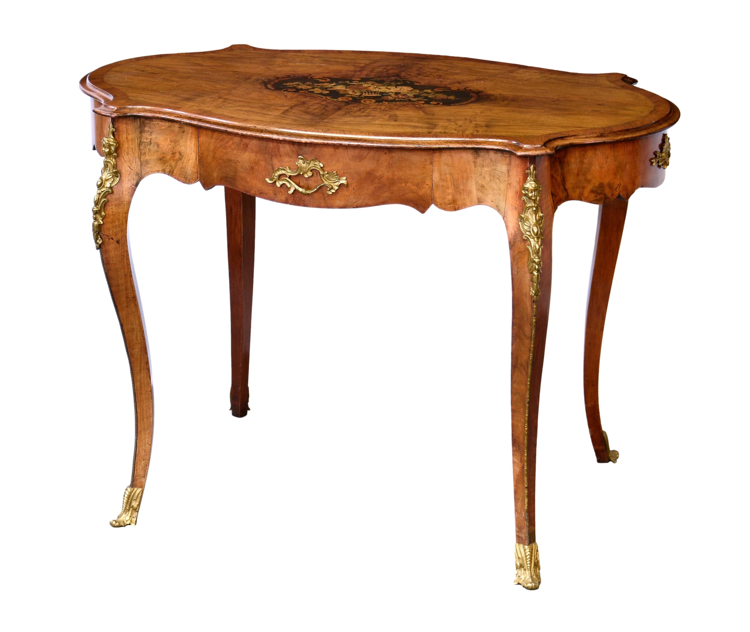 An English walnut, kingwood, marquetry and gilt metal oval centre table,in the Louis XV taste