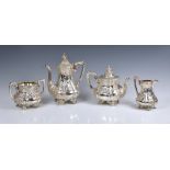 A Victorian cast silver four piece tea service, Charles Reily & George Storer, London 1851,