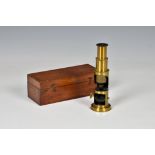 A cased Victorian or later students brass monocular microscope, unmarked, complete with some glass