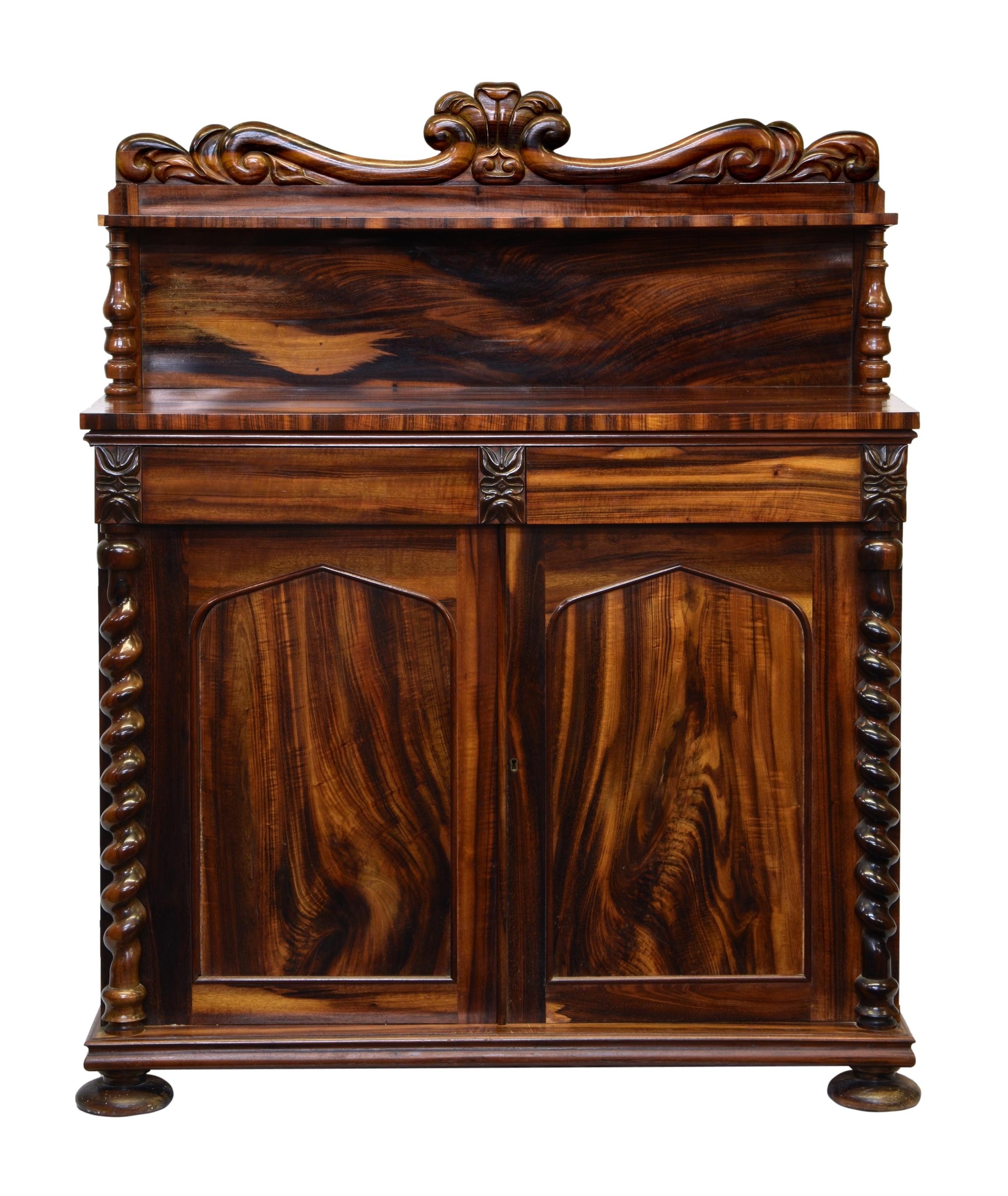 A William IV goncalo alves chiffonier, the foliate scroll and lappet carved back with a single