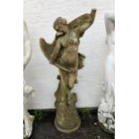 A well weathered marble garden statue, of a maiden and eagle, its wings outstretched, rising from