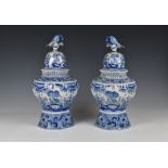 A pair of Dutch Delft vases and covers, probably 20th century, baluster form with flared,