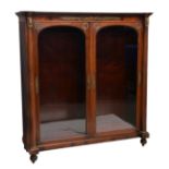 A mahogany French Empire Revival display cabinet, with figural and foliate brass mounts and two