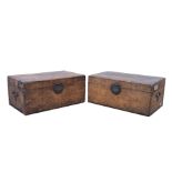 A pair of Chinese hide covered small trunks, early 20th century, with brass locks and handles,