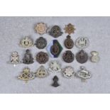 A collection of military WW2 plastic economy cap badges, to include South Staffordshire Regiment;