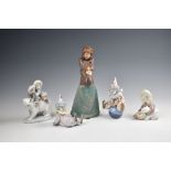 Five Lladro and Nao figures, including two Lladro clowns, no. 5812 'Tired Friend' and 5813 'Having a