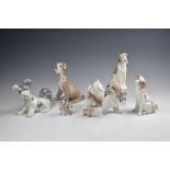 Seven figures of dogs by Lladro and Nao, including three large figures by Lladro, two slightly