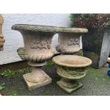 A pair of composite stone garden urns, plus another planter, smaller. (3). *