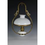 A 19th century style brass ceiling oil lamp, 20th century, fitted for electricity, with white milk