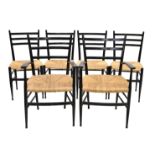 A set of six Italian black lacquered dining chairs in the manner of Gio Ponti, 1950s, believed to