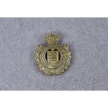 Royal Guernsey Militia Channel Islands cap badge, circa 1925-40, die-stamped brass crowned title