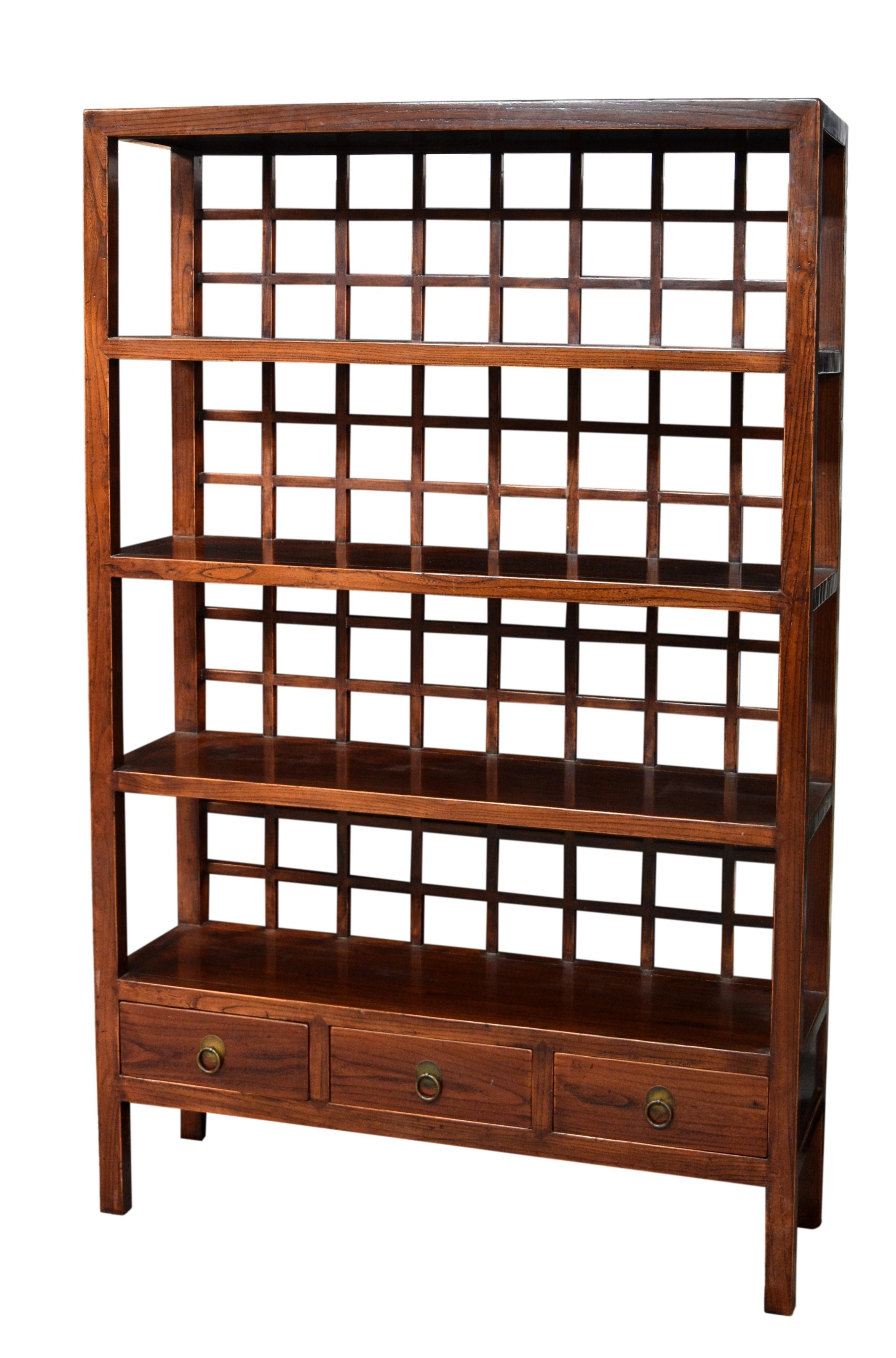 A set of Chinese elm wood open book shelves, probably 19th century, the four graduated, open