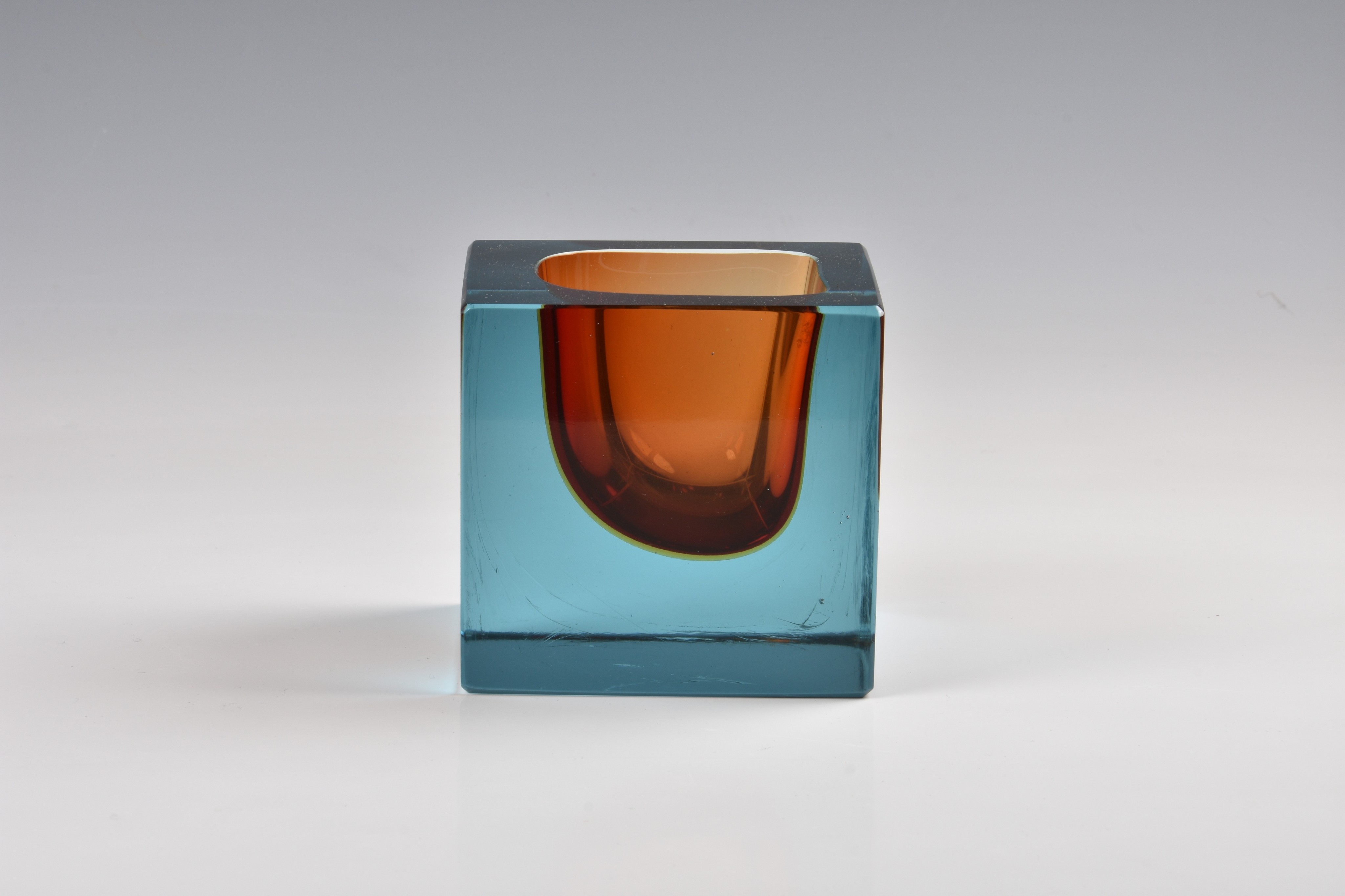 A 1960s square art glass paperweight style vase, in blue and orange, 3¾in. (9.5cm.) high.. * - Image 2 of 4