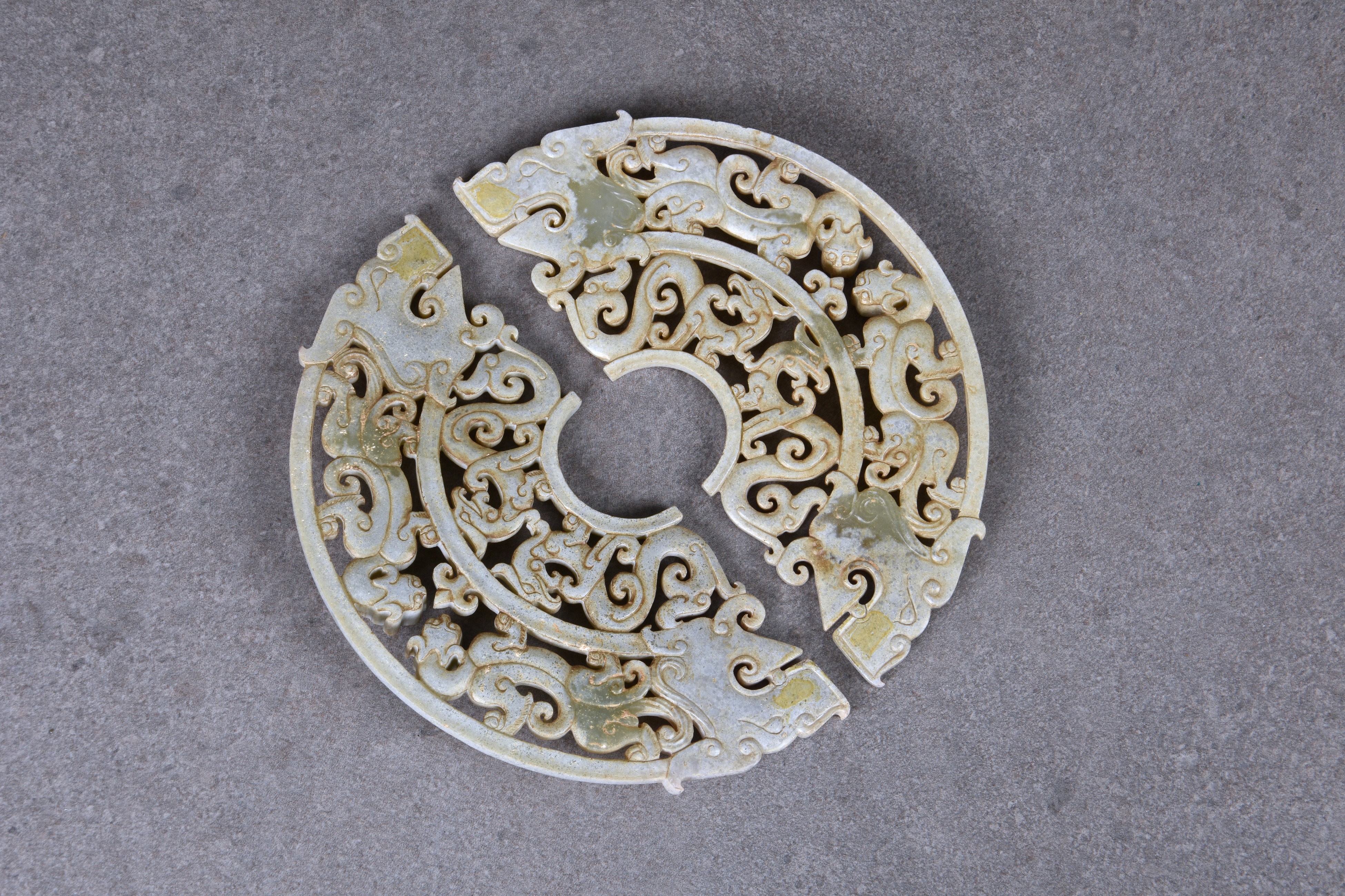 A pair of Chinese celadon jade dragon disc pendants, in the Han Dynasty style, but probably 20th - Image 2 of 2
