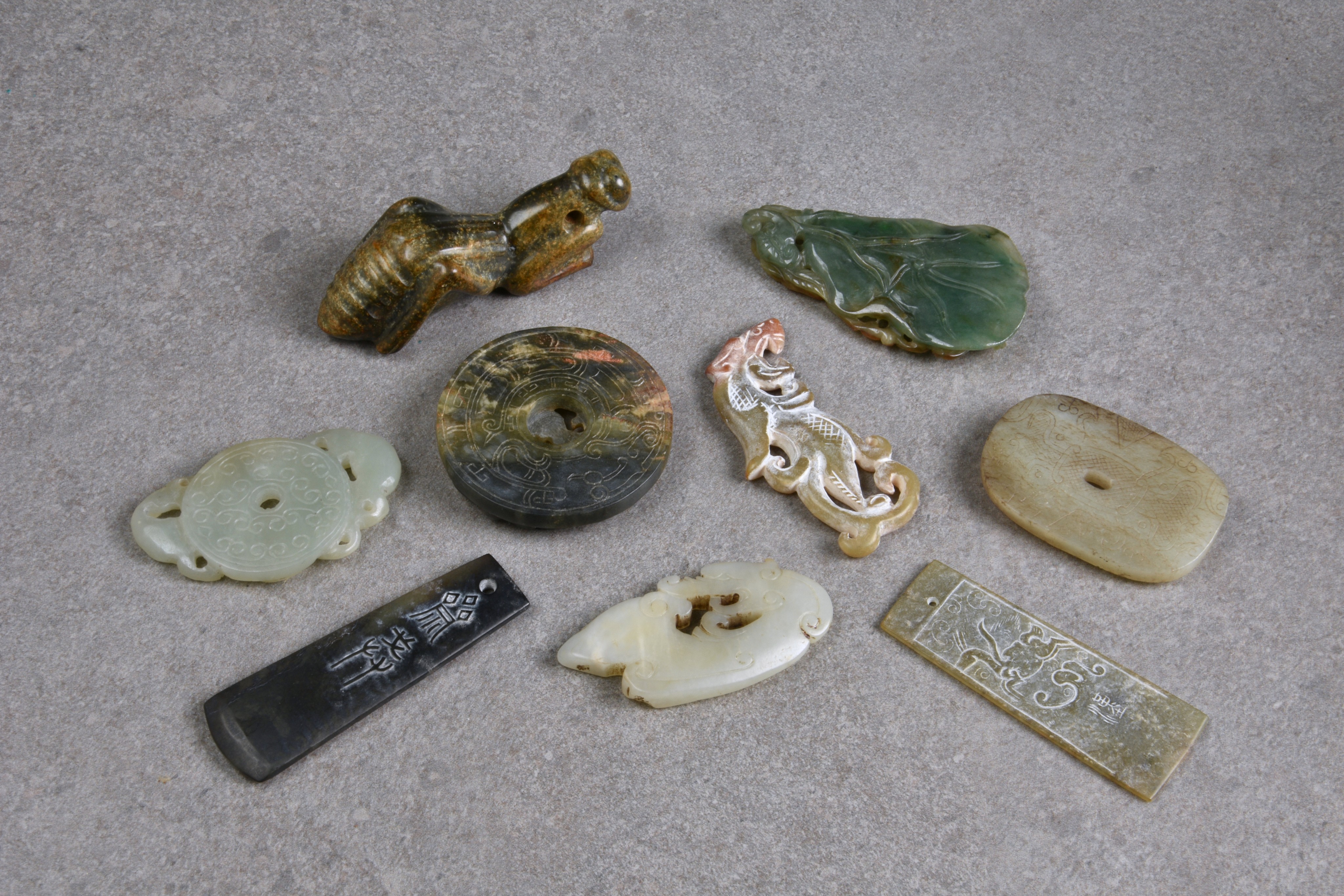 Nine Chinese jade carvings, all probably 20th century, including a praying mantis, a disc carved - Image 2 of 2