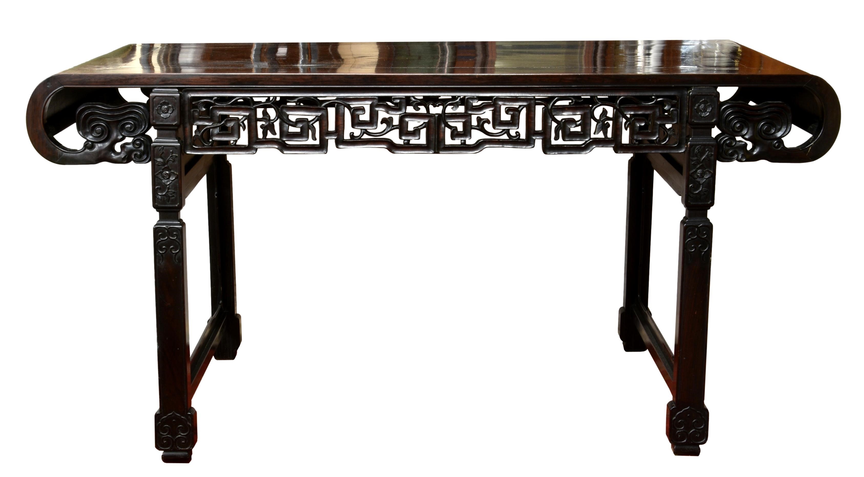 A large 19th century Chinese dark hardwood altar table, probably zitan, the rectangular cleated
