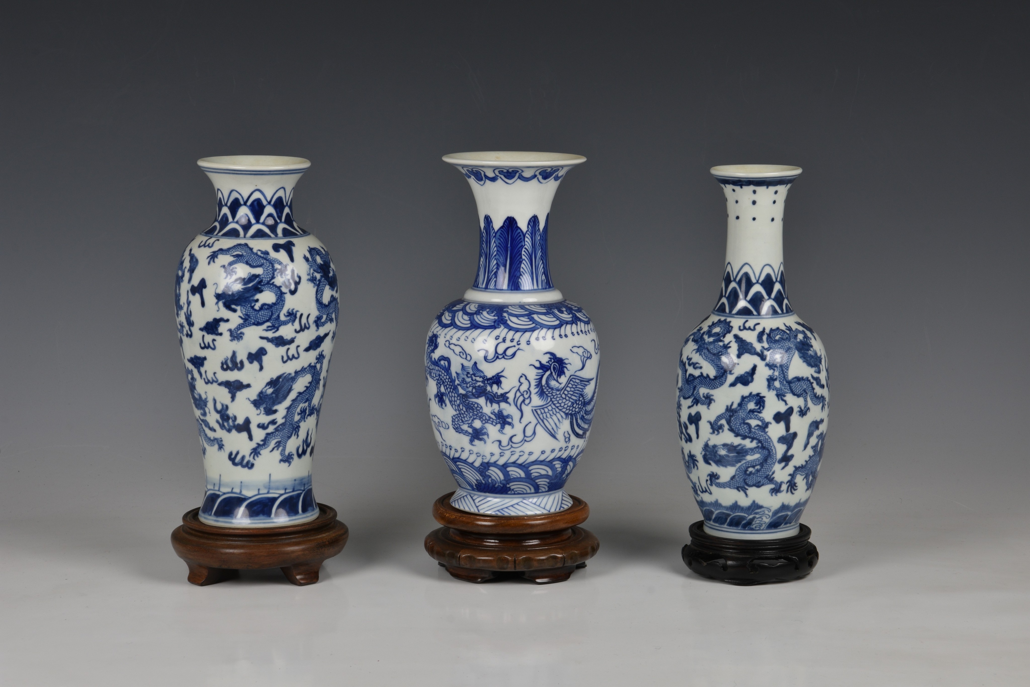 Three Chinese porcelain blue and white vases, 20th century, comprising a baluster vase with six