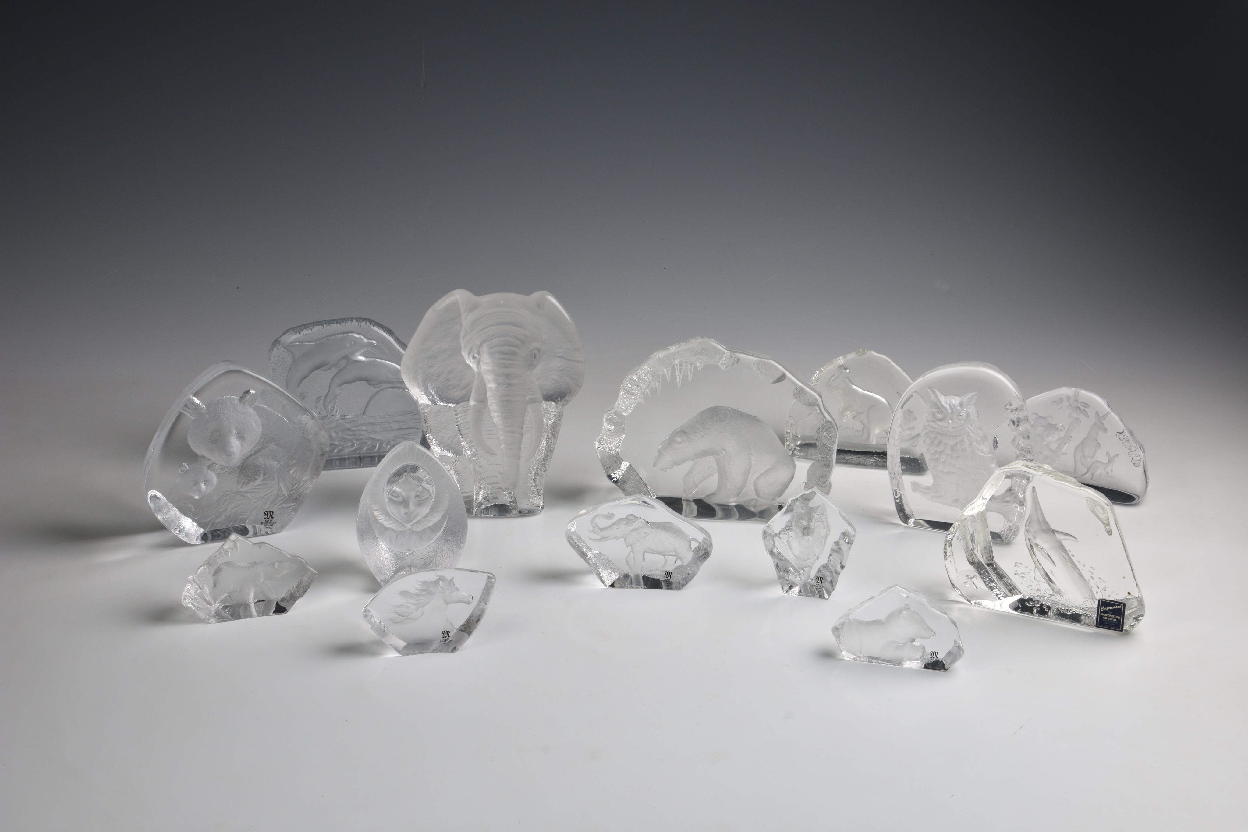 Nine intaglio glass sculptures or paperweights by Mats Jonasson, Sweden, depicting animals including