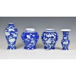 Four Chinese blue and white prunus blossom decorated vases, 20th century, comprising an inverted