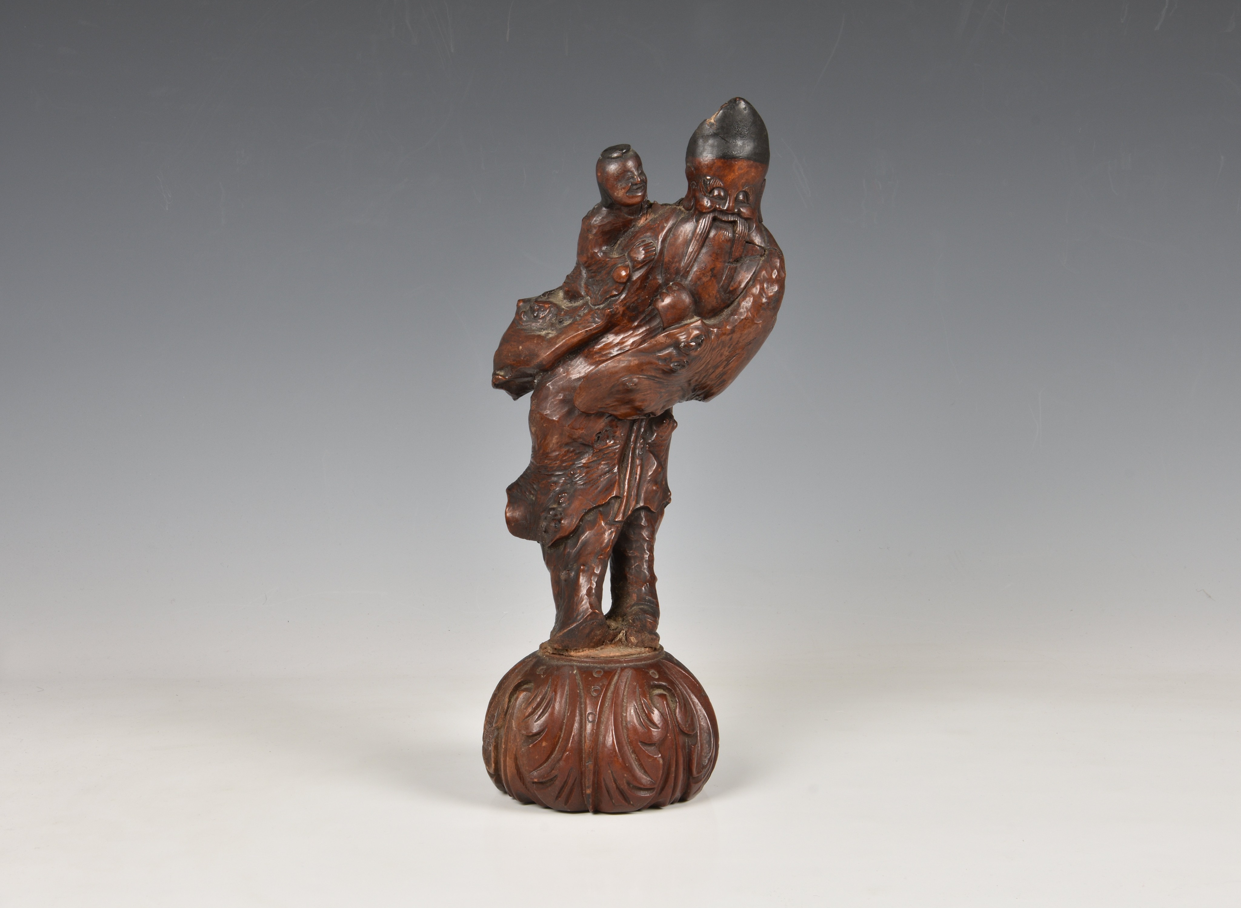 A Chinese carved rootwood figure of Shoulao, Qing dynasty, probably 18th / 19th century, the