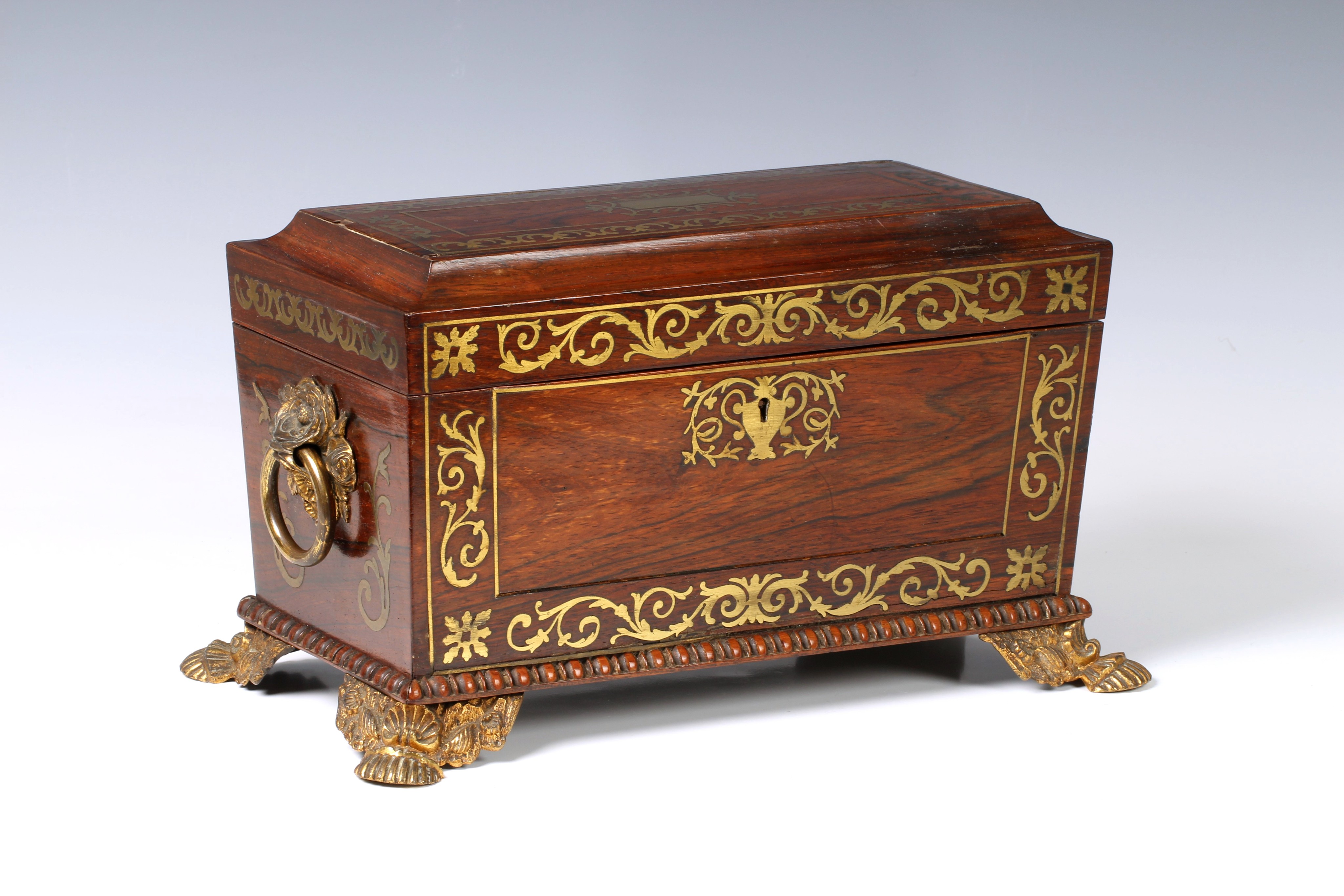 A Regency Rosewood and brass inlaid tea caddy, with blue velvet lined interior with void for