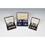 Three cased sets of silver coffee spoons, comprising a set of six with tongs, Deakin & Francis,