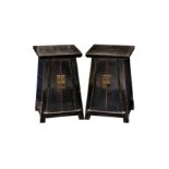 A pair of Chinese black lacquered elmwood two door tapered small cabinets, probably Qing Dynasty,