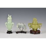Three Chinese jade style hardstone carvings, 20th century, comprising a covered tripod censer, in