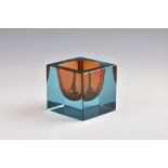 A 1960s square art glass paperweight style vase, in blue and orange, 3¾in. (9.5cm.) high.. *