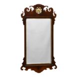 A George II style mahogany and parcel gilt fretwork mirror, early 20th century, the rectangular