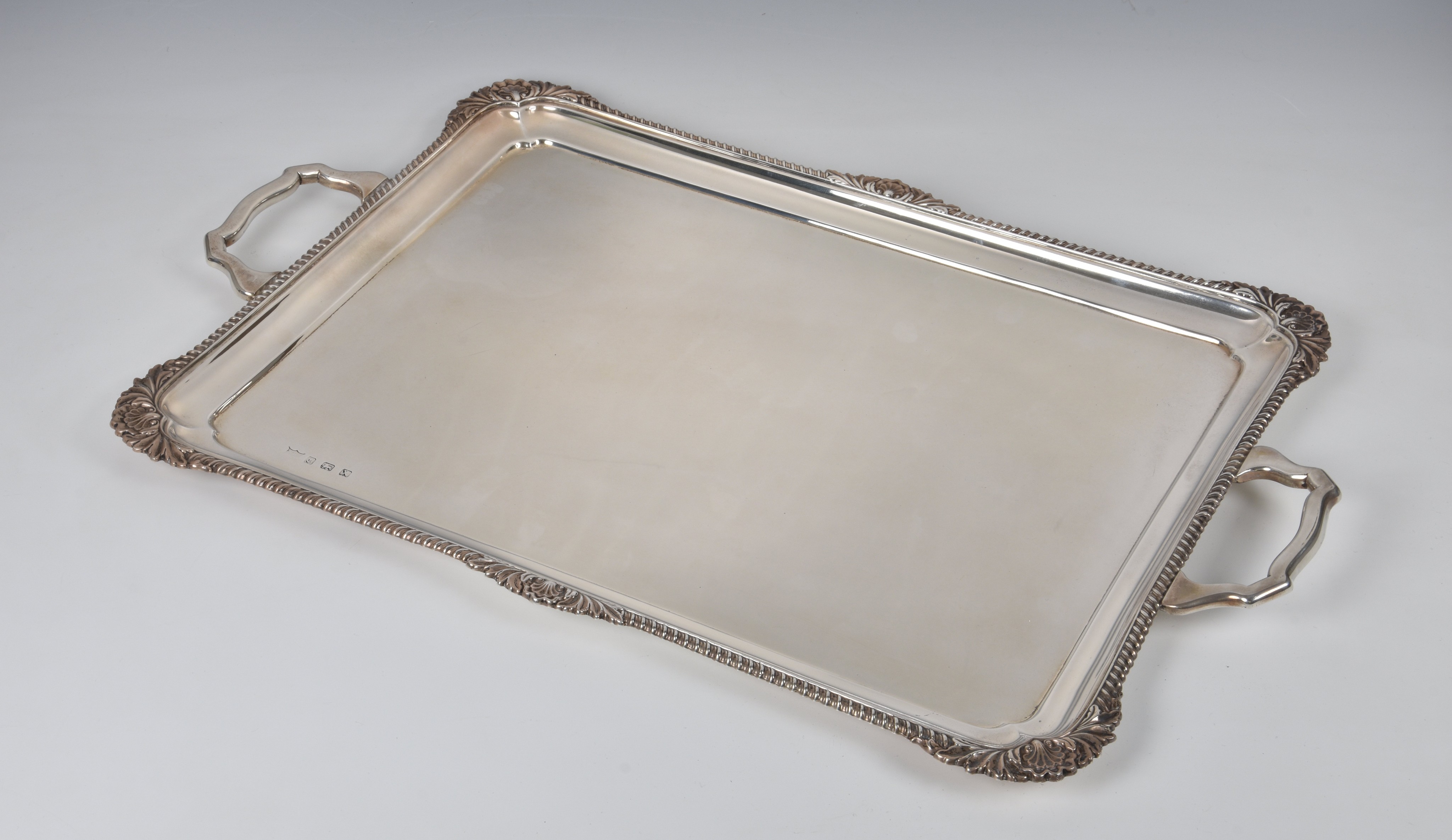 A George VI silver drinks or tea tray, B. Bros., Birm. 1947, of rectangular form with two,