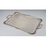 A George VI silver drinks or tea tray, B. Bros., Birm. 1947, of rectangular form with two,