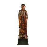 A lacquered and gilt carved wooden figure of a standing monk or Lohan, probably Burmese, Mandalay