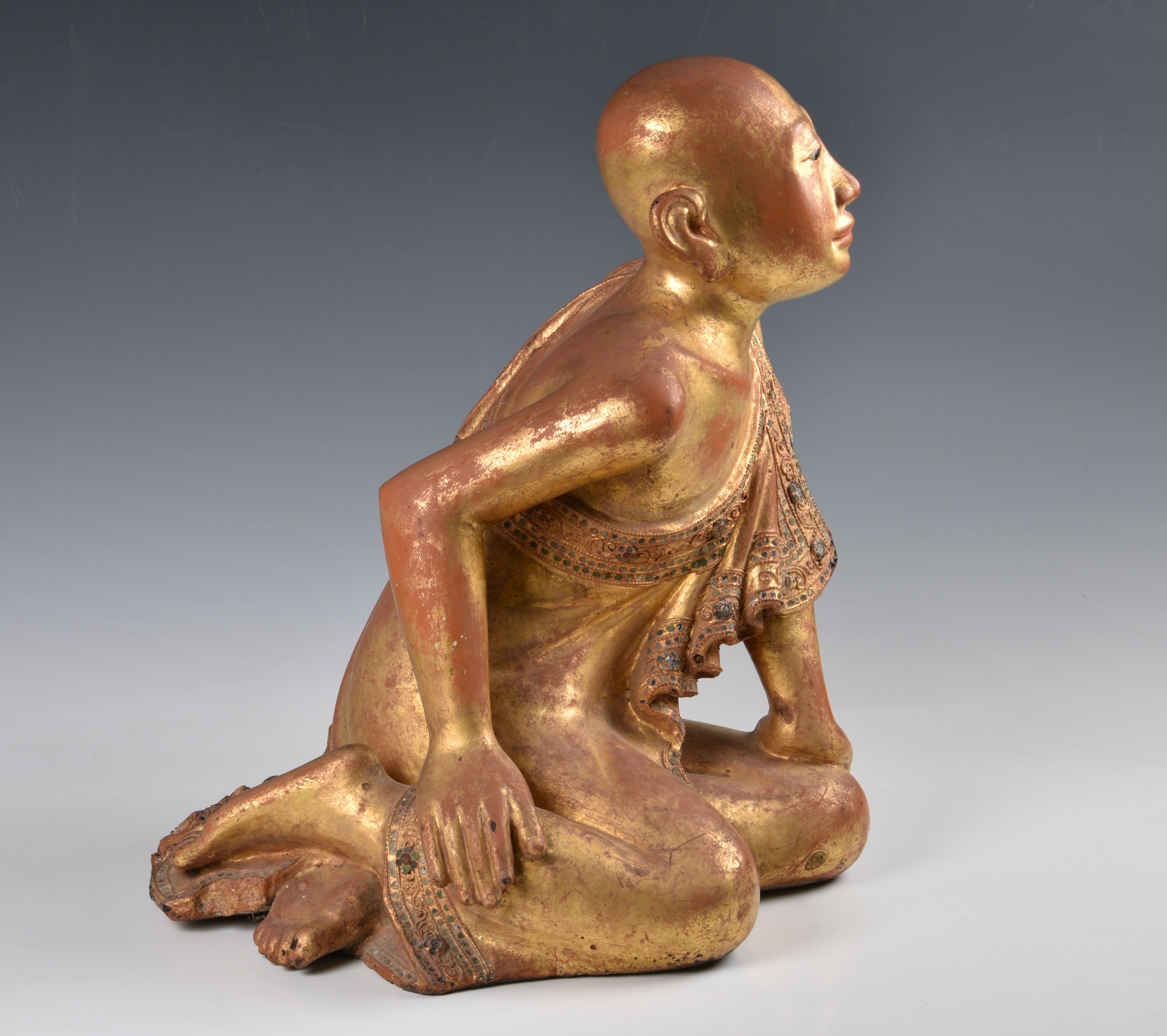 A Burmese Mandalay carved, lacquered and jewelled gilt wood figure of a seated monk, probably late - Image 5 of 9