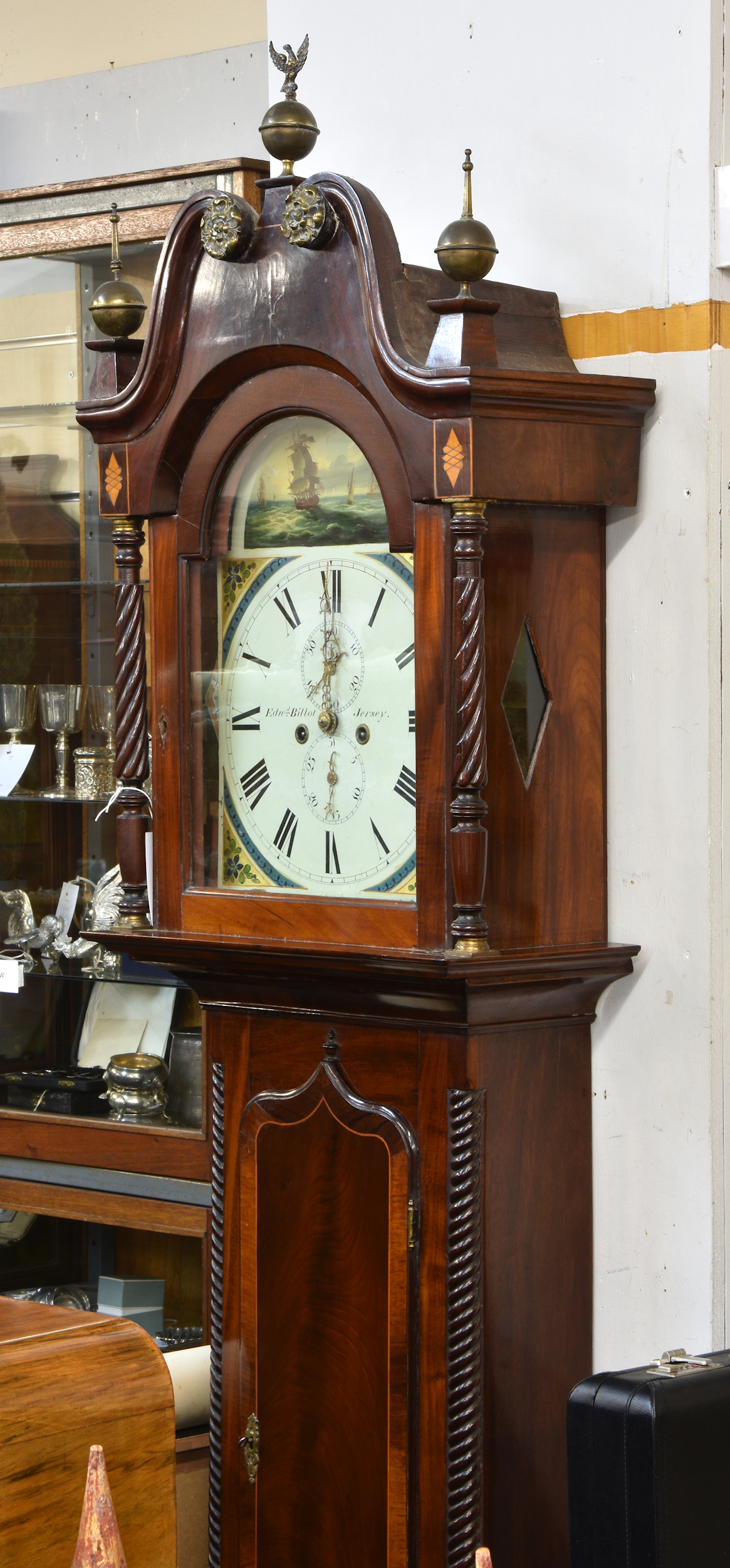 An inlaid mid-19th century Channel Islands mahogany and rosewood cross-banded longcase clock, the