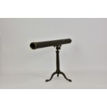 An antique brass single draw counter top telescope on stand, with folding tripod legs and pointed