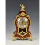 A 19th century tortoiseshell and gilt metal mantel clock, with French style Roman enamel numerals,