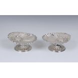 A pair of Victorian silver pedestal scallop shell dishes, L Spiers, Birmingham, 1892, of shaped