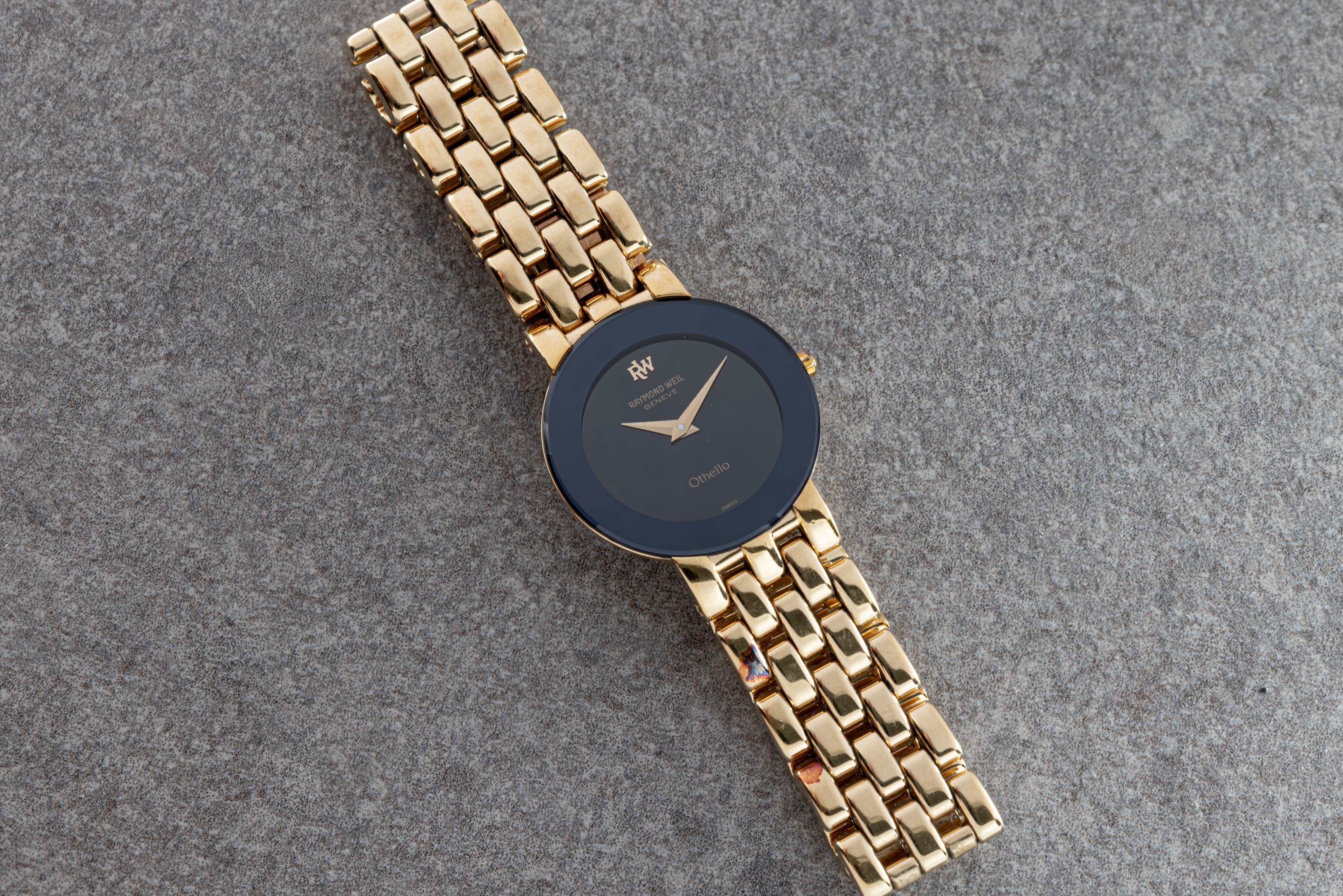A ladies Raymond Weil Othello gold plated quartz bracelet watch, ref. 147, the dark grey 16.5mm.