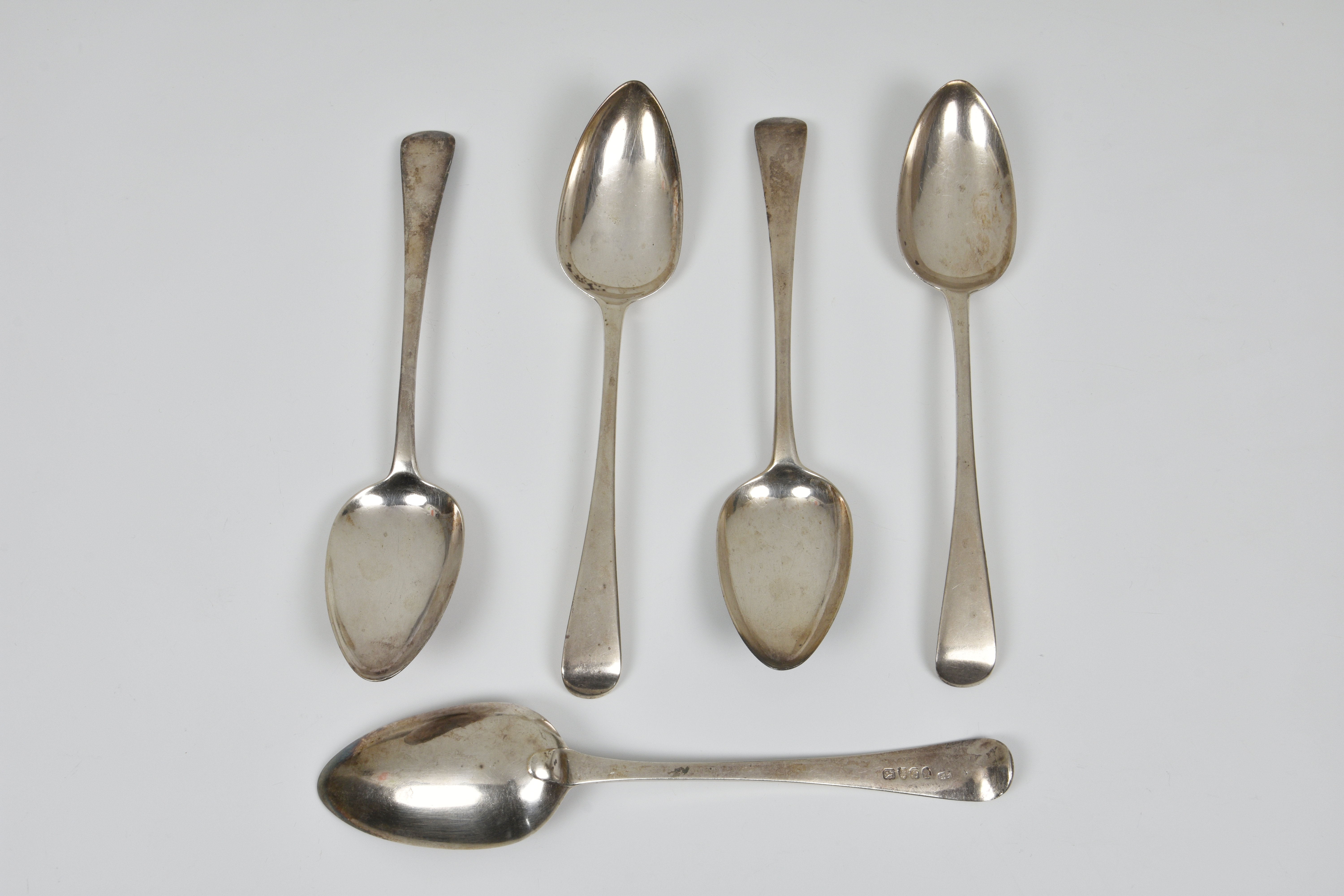Five George III silver Old English pattern table spoons, all London, to include one by John