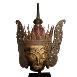 A large Thai gilt and lacquered papier-mache Buddha head, 20th century, the crowned head with serene