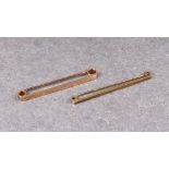 Two 9ct gold bar tie pins, 2in. (5.1cm.) long. (2). *